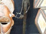 two masks that are sitting next to each other