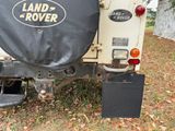 a black cover on the back of a land rover