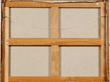 a picture of a wooden window with a curtain on it