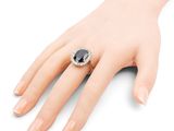 a close up of a person ' s hand with a ring on it