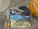 a bag of toothbrushes and other items on the ground
