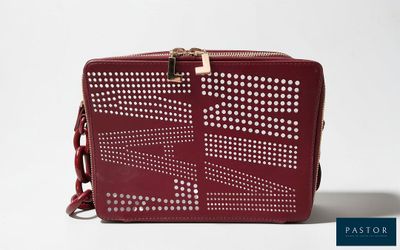 an image of a red handbag with holes on it