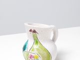 an image of a white vase with a pear painted on it