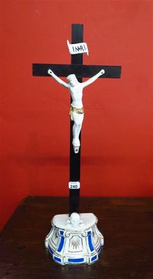 a statue of jesus on a cross on a table