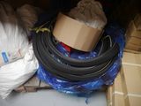 a pile of tires and other items in the back of a truck