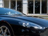 a black sports car parked in front of a building