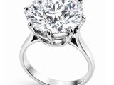 a close up of a diamond ring on a white background