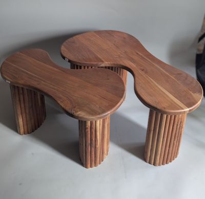 two wooden stools that are sitting on a table
