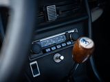 a close up of a car ' s dashboard with a steering wheel