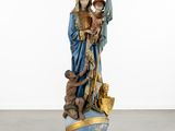 an image of a statue of a woman holding a child
