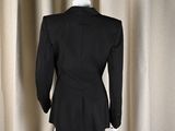 the back view of a black jacket on a mannequin mannequin mannequin mannequin mannequin mannequin mannequin manne