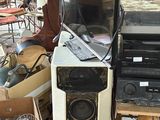 a pile of electronics and other items in a room