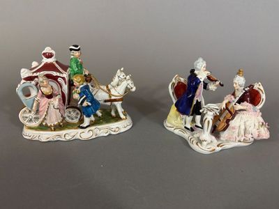 two figurines of people riding on horses and a horse drawn carriage