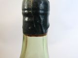 a close up of a bottle of liquor on a table