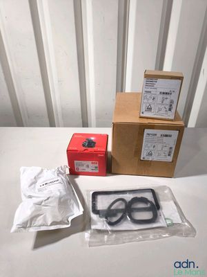 a box of scissors and a pair of scissors on a table