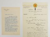 an old letter and a piece of paper on a white surface