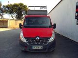 a red van that is parked in a parking lot