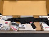 a gun in a box with other items in it