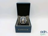 a watch that is in a box on a white surface