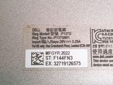 the label on the back of a silver laptop computer with chinese writing