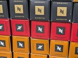several boxes of wine are stacked on top of each other in a store