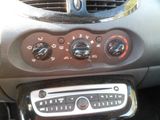 a car dashboard with a clock and a radio in it
