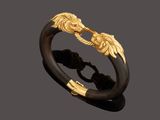 a gold and horn horn ring, by person