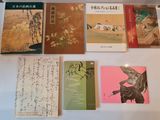 a lot of books on a table with asian writing on them