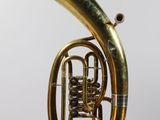 a brass instrument that is hanging from the ceiling