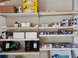 a shelf with many items on it in a room