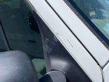 a close up of a car ' s side mirror with a sticker on it