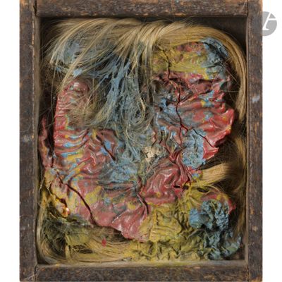 a close up of a piece of art in a wooden box