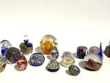 a lot of glass marbles sitting on a white surface
