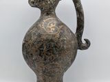 an image of a vase with a handle on a white background