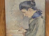 painting of a woman writing in a wooden frame on a wall