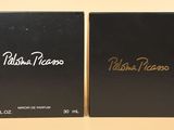 two black boxes with gold writing on them sitting on a table
