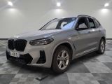 the new bmw x3 suv is parked in a showroom