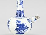 blue and white vase with flowers and birds on it