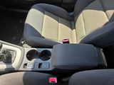 the interior of a car with two seats and a center console