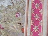 a picture of a curtain with a bird and flowers on it