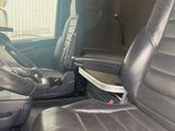 a seat in the back of a truck with a cup holder