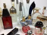 many different types of perfume bottles on the table