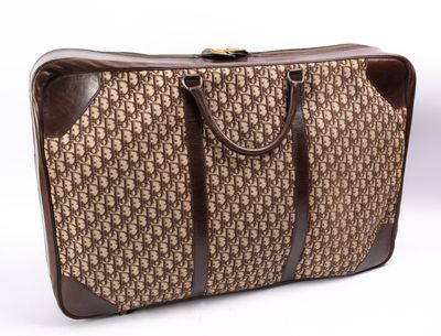 Christian DIOR, Valise siglée en toile et cuir, L : 75 cm, L…