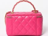 a pink quilted purse with a gold chain handle