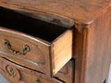 a wooden chest of drawers with a drawer on top of it