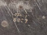 a close up of a metal object with a tag on it