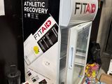 a refrigerator that is sitting on a table in a room
