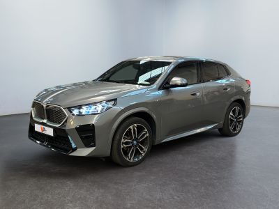 the new bmw x1 suv is parked in a showroom