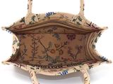 an image of a handbag with a floral design on it