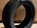 tire on the floor next to a cardboard box and cardboard boxes